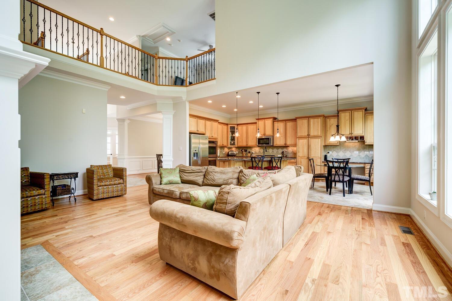 3907 Morvan Way Raleigh, NC 27612 - Photo 4 of 69 a living room with furniture and a wooden floor