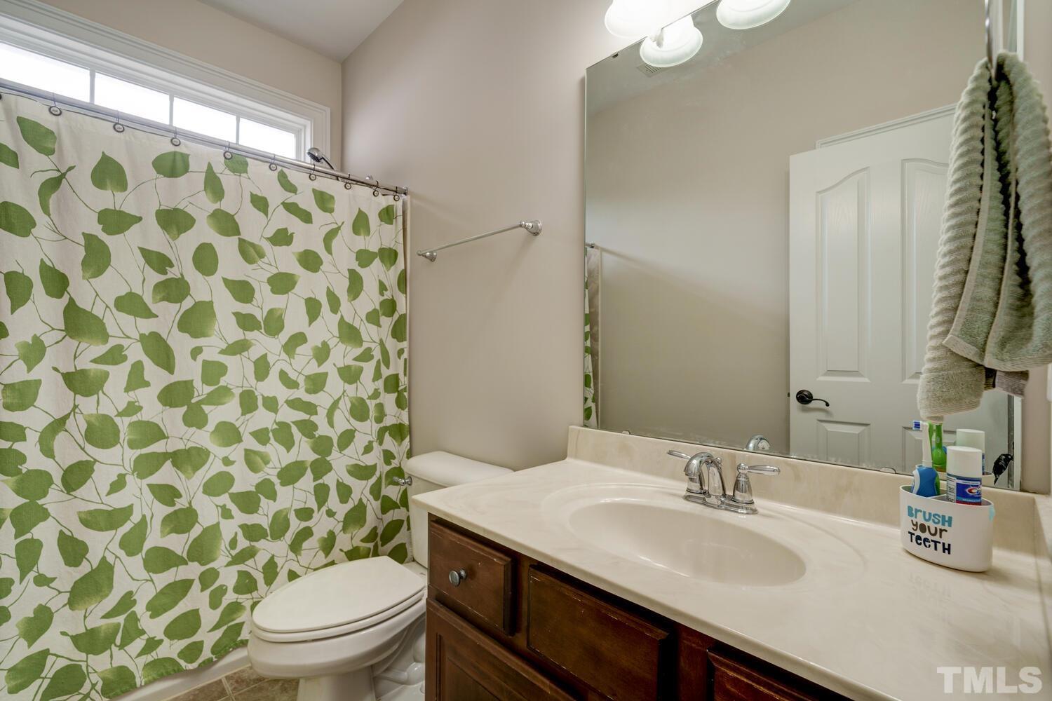 3907 Morvan Way Raleigh, NC 27612 - Photo 41 of 69 a bathroom with a sink toilet and shower