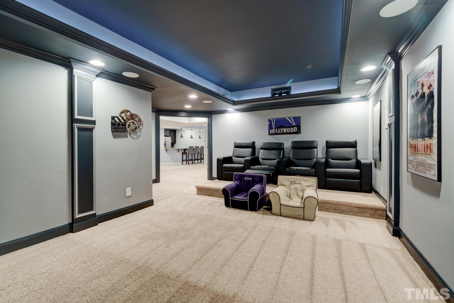 3907 Morvan Way Raleigh, NC 27612 - Photo 43 of 69 a living room with furniture and a flat screen tv