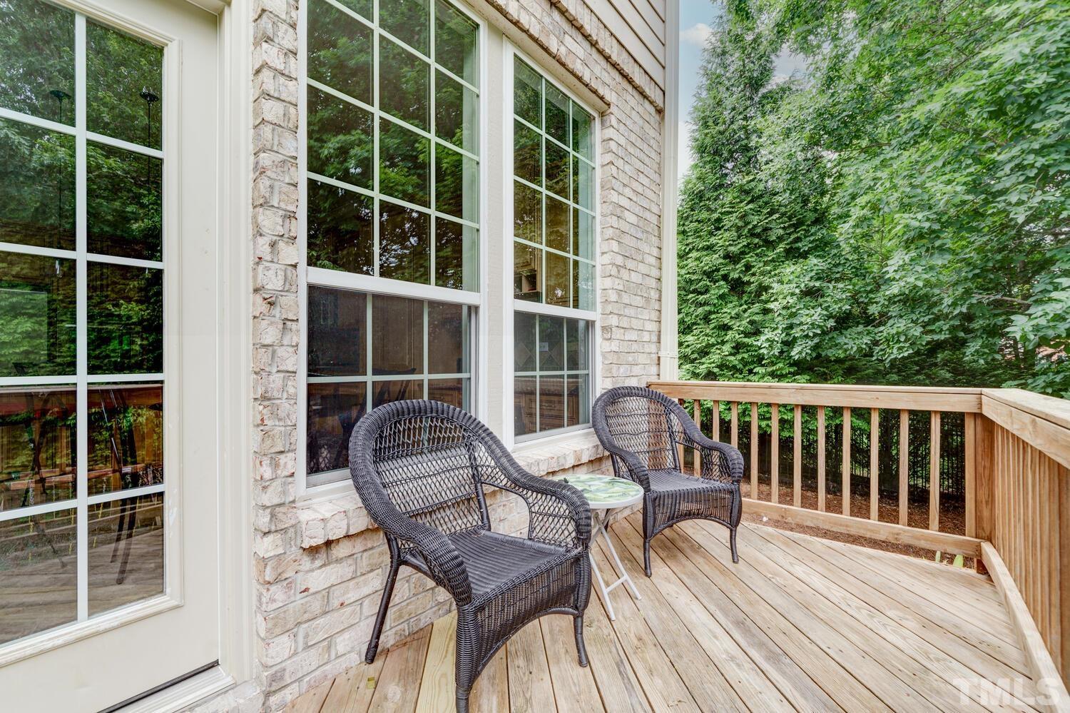3907 Morvan Way Raleigh, NC 27612 - Photo 55 of 69 a view of a chair and table on the deck