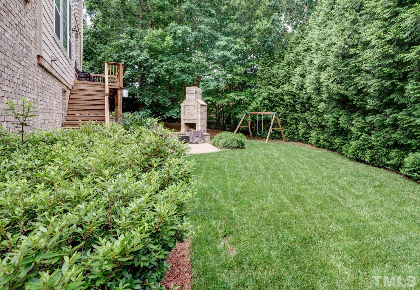 3907 Morvan Way Raleigh, NC 27612 - Photo 60 of 69 a view of a backyard with plants and large trees