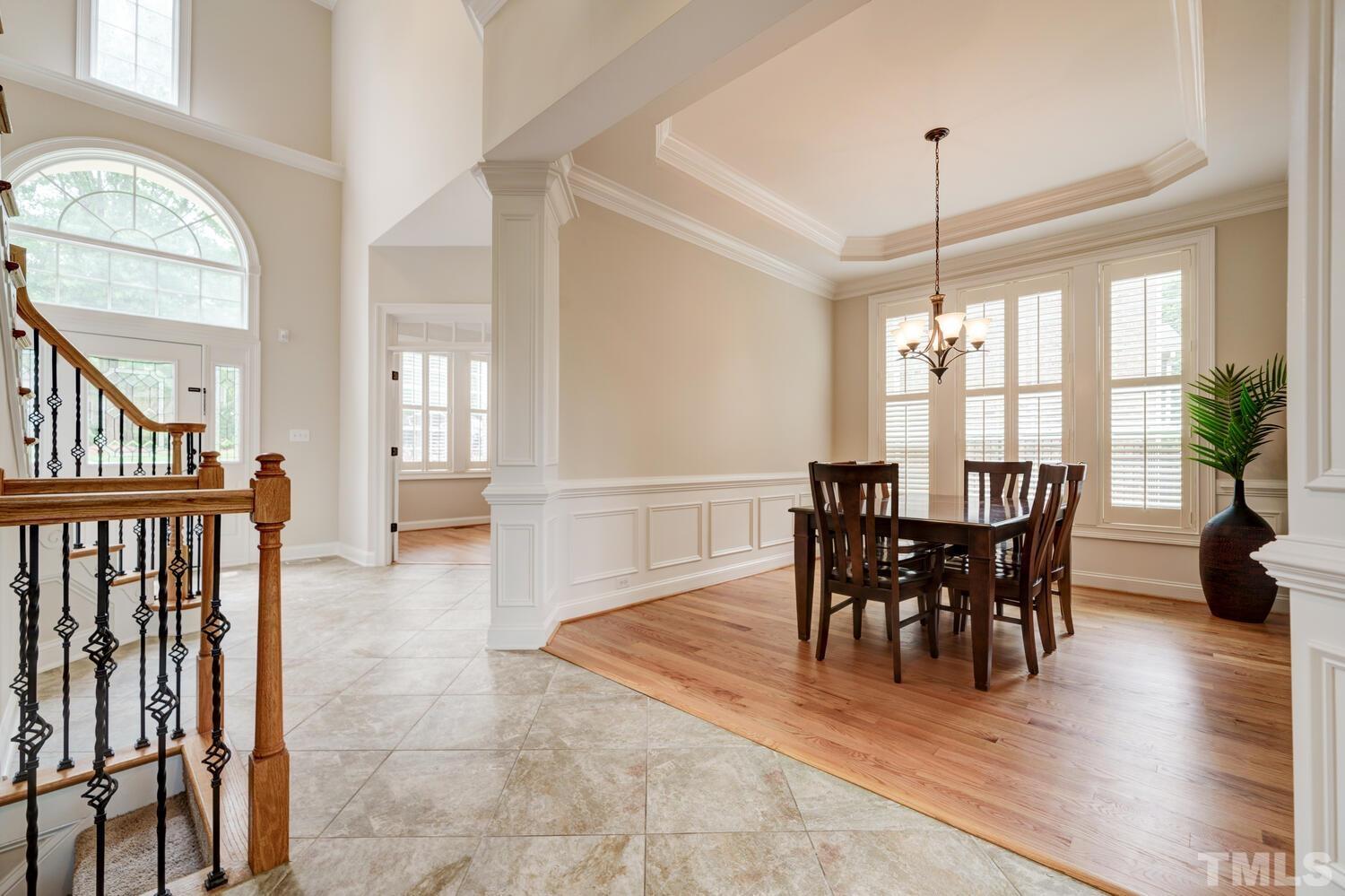 3907 Morvan Way Raleigh, NC 27612 - Photo 8 of 69 a view of a dining room with furniture window and wooden floor