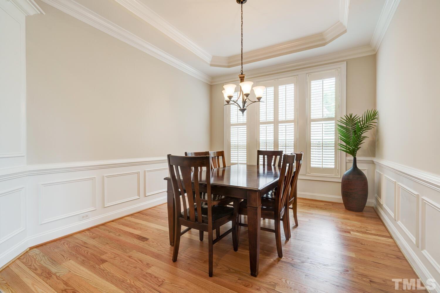 3907 Morvan Way Raleigh, NC 27612 - Photo 10 of 69 a view of a dining room with furniture window and wooden floor