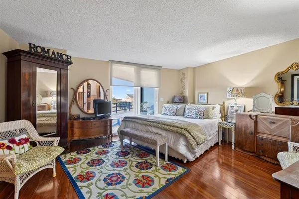 a bedroom with bed and windows