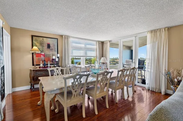 a view of a dining room with furniture window and wooden floor