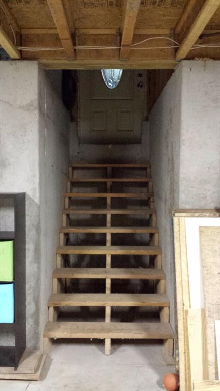159 Hatch Road New Gloucester, ME 04260 - Photo 34 of 34 Stairs from basement into 3 car garage!