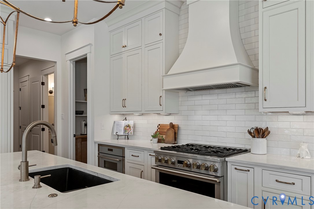 5012 Lake Summer Loop Moseley, VA 23120 - Photo 25 of 67 a kitchen with cabinets and appliances