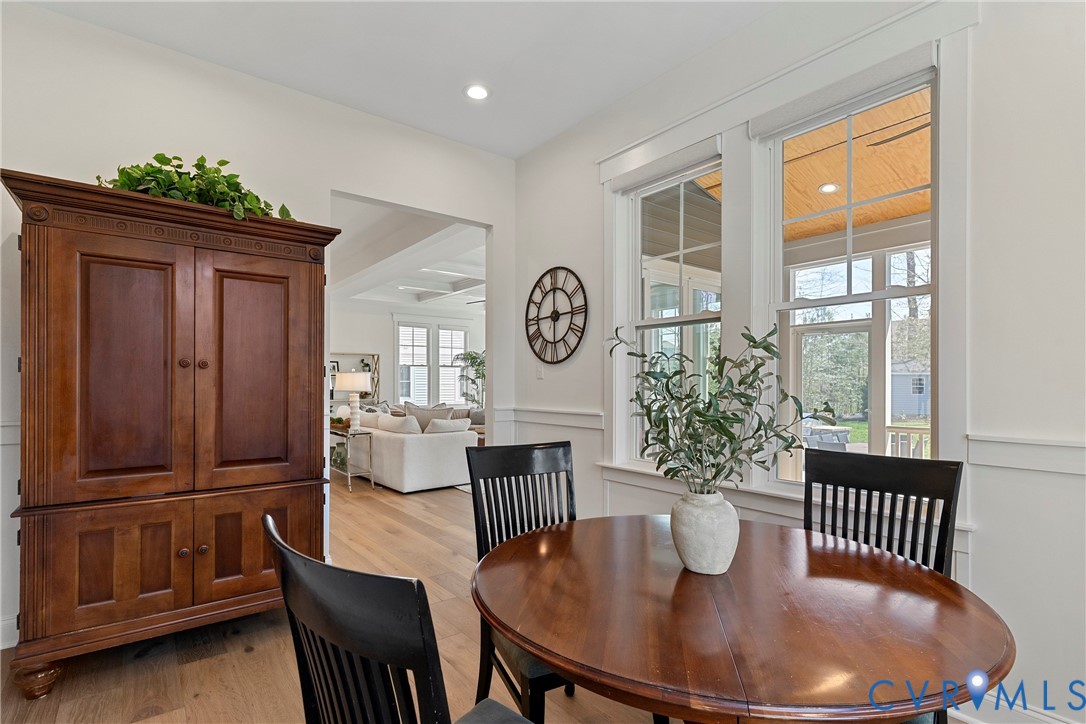 5012 Lake Summer Loop Moseley, VA 23120 - Photo 29 of 67 a dining room with furniture a window and wooden floor