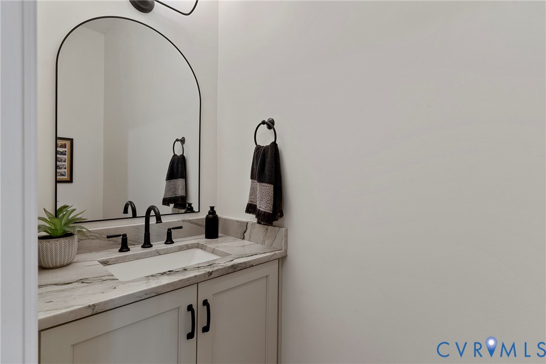 5012 Lake Summer Loop Moseley, VA 23120 - Photo 32 of 67 a bathroom with a granite countertop sink and a mirror