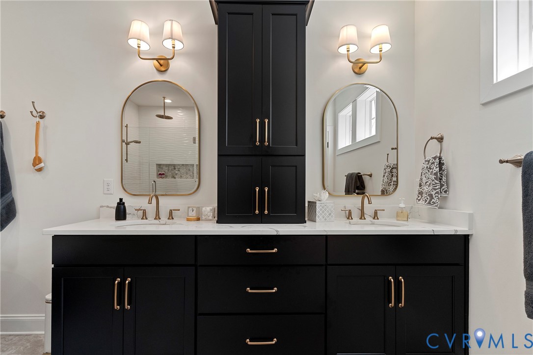5012 Lake Summer Loop Moseley, VA 23120 - Photo 40 of 67 a bathroom with double vanity sinks and a mirror