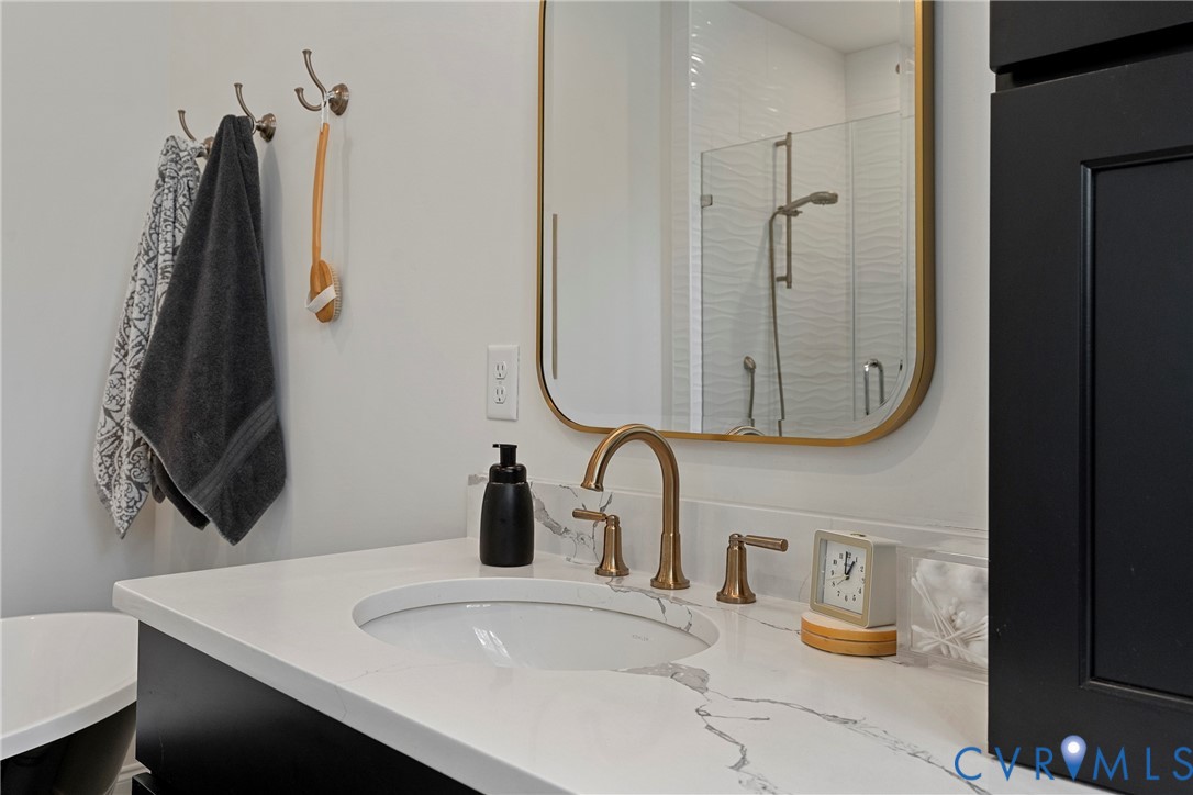 5012 Lake Summer Loop Moseley, VA 23120 - Photo 42 of 67 a bathroom with a sink vanity and a mirror