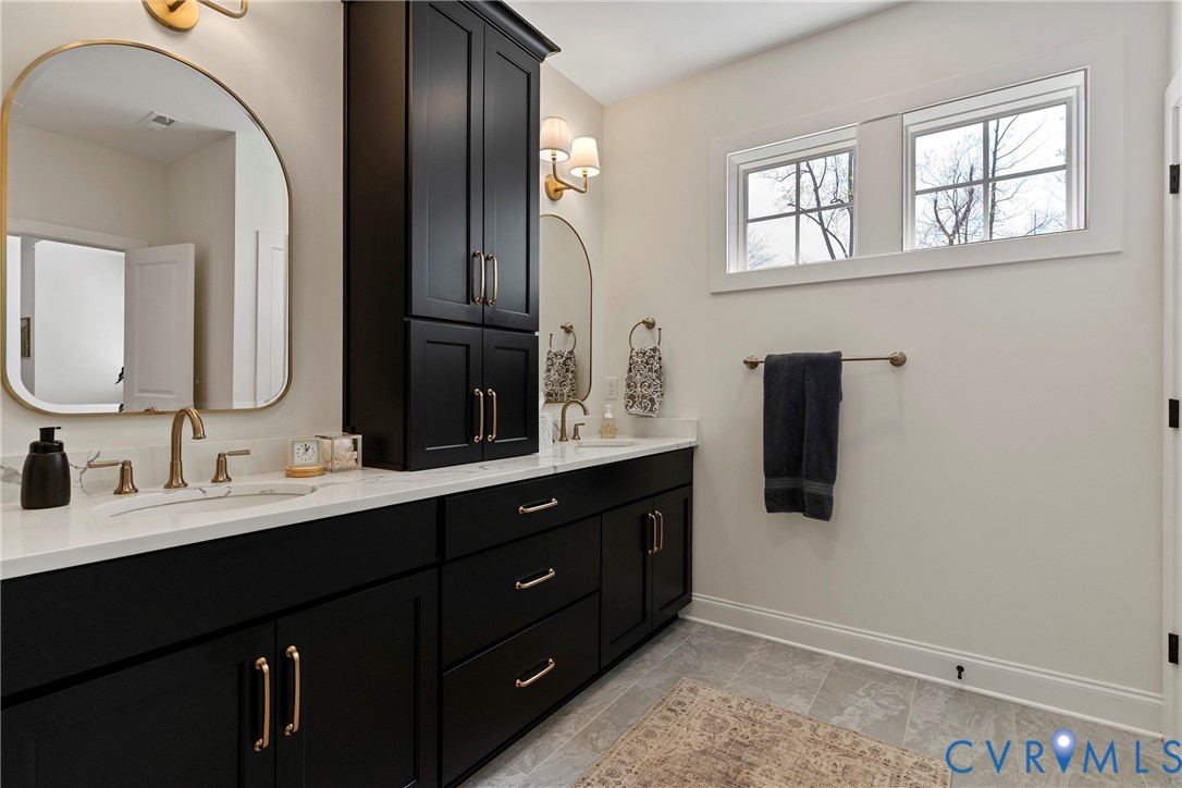 5012 Lake Summer Loop Moseley, VA 23120 - Photo 45 of 67 a bathroom with a double vanity sink and mirror