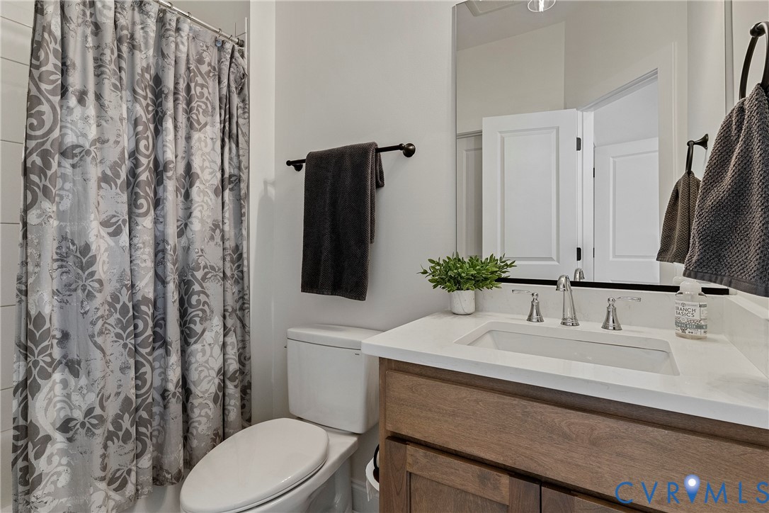 5012 Lake Summer Loop Moseley, VA 23120 - Photo 55 of 67 a bathroom with a sink toilet and mirror