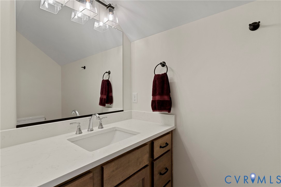 5012 Lake Summer Loop Moseley, VA 23120 - Photo 57 of 67 a bathroom with a sink vanity and a mirror