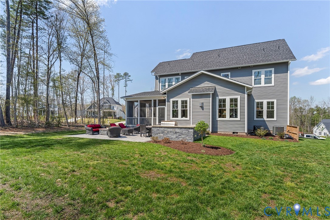 5012 Lake Summer Loop Moseley, VA 23120 - Photo 59 of 67 a front view of a house with a yard and trees