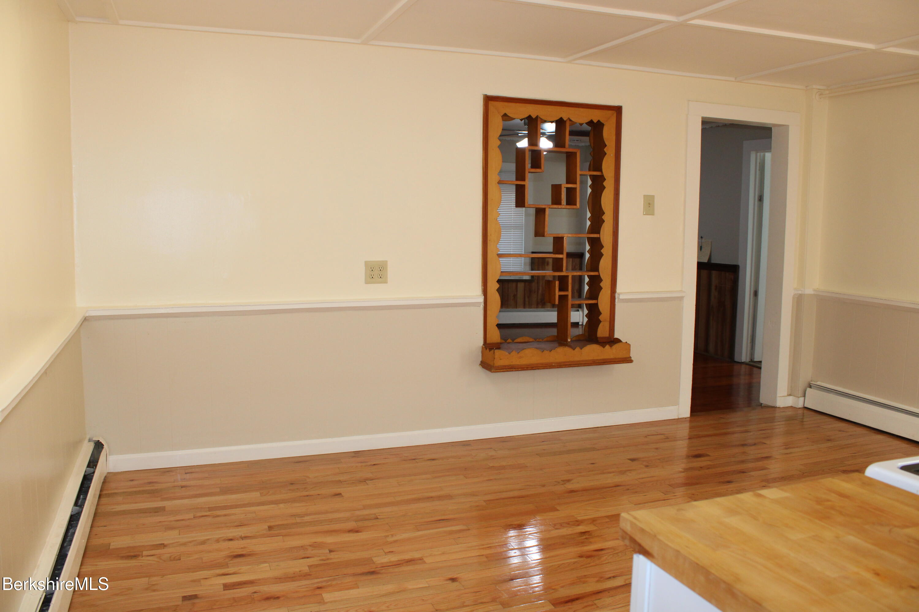 3-5 Pleasant Street Pittsfield, MA 01201 - Photo 12 of 40 a view of a room that has wooden floor and bench