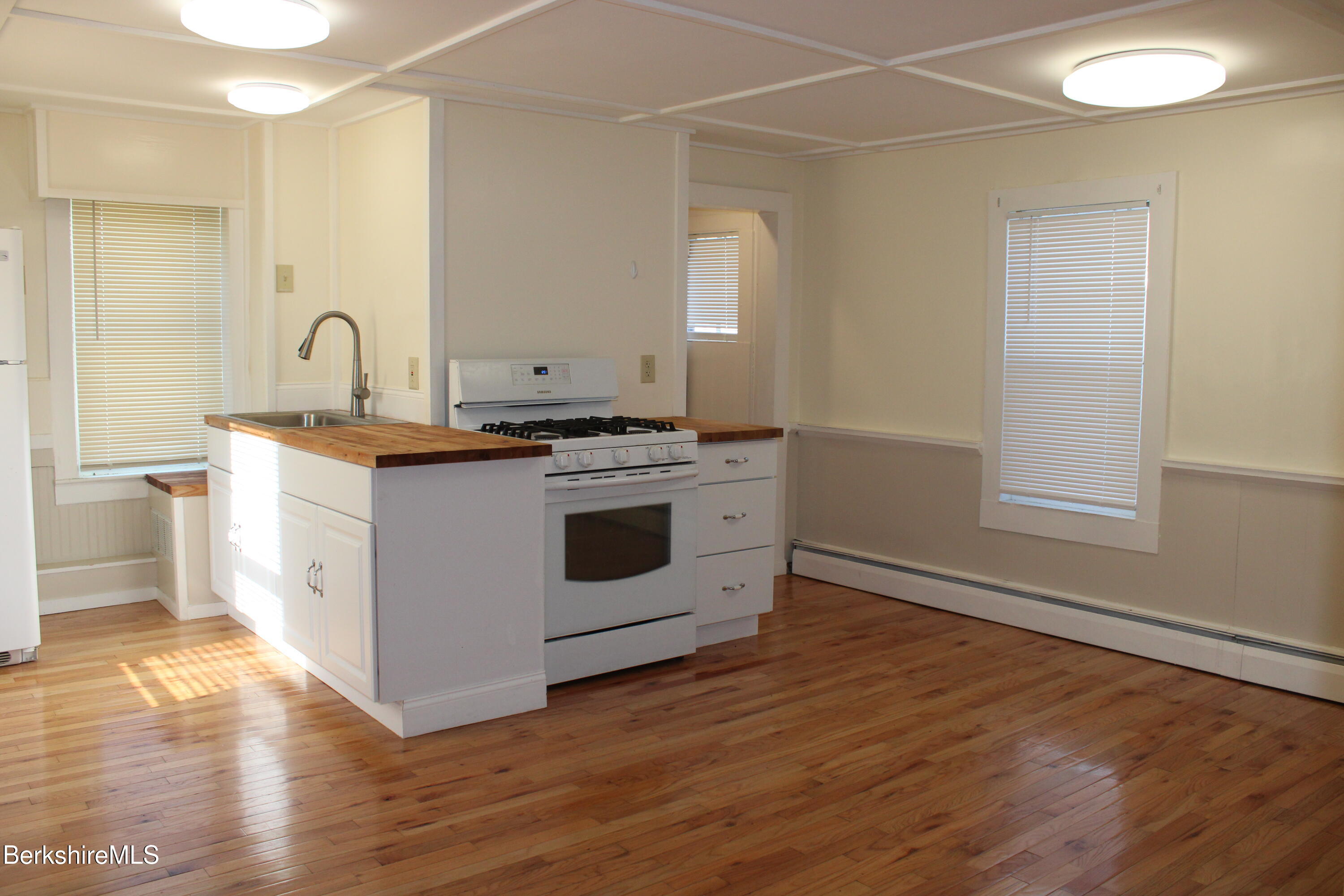 3-5 Pleasant Street Pittsfield, MA 01201 - Photo 13 of 40 a kitchen with a stove top oven and sink