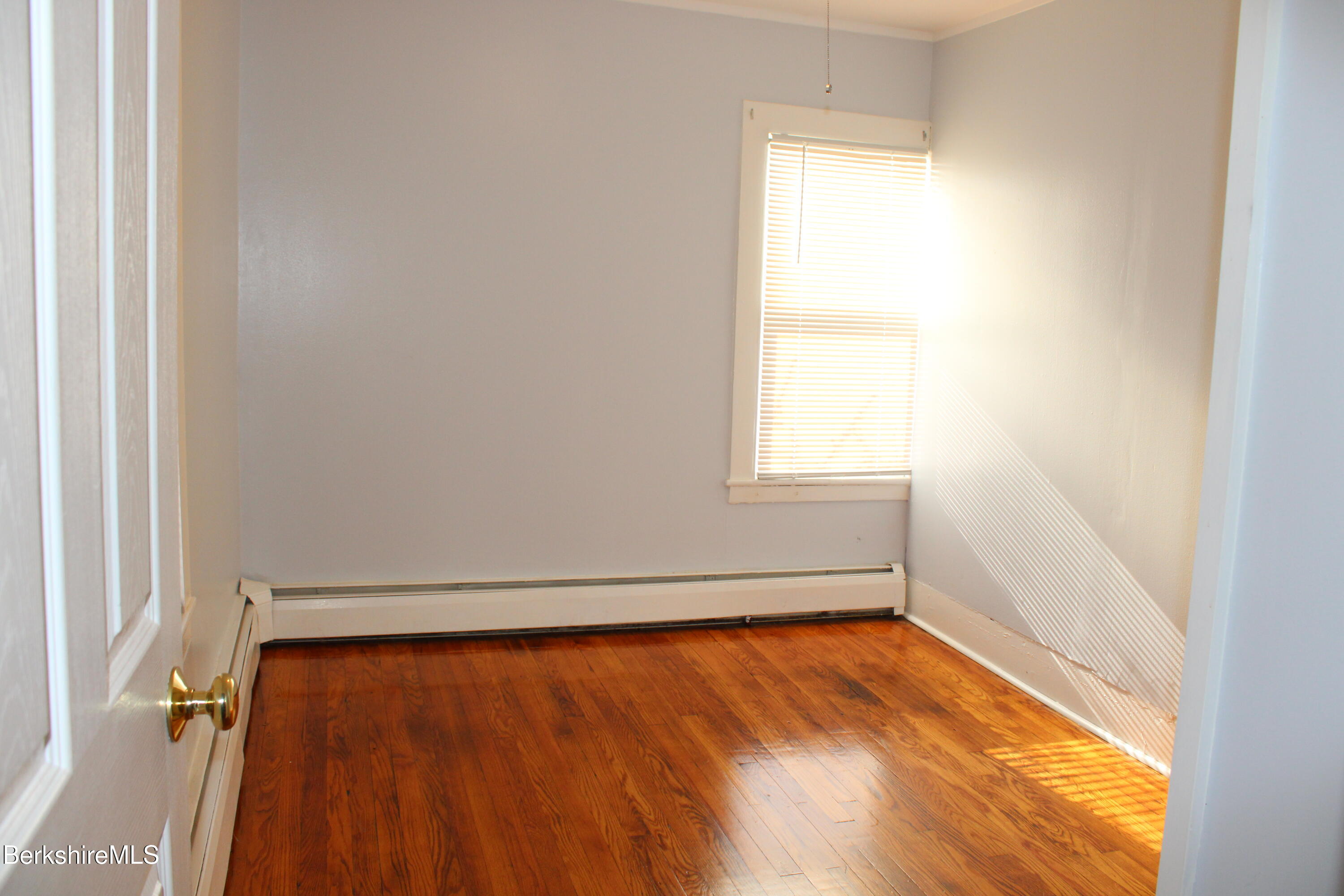 3-5 Pleasant Street Pittsfield, MA 01201 - Photo 23 of 40 a view of a room with wooden floor and a window
