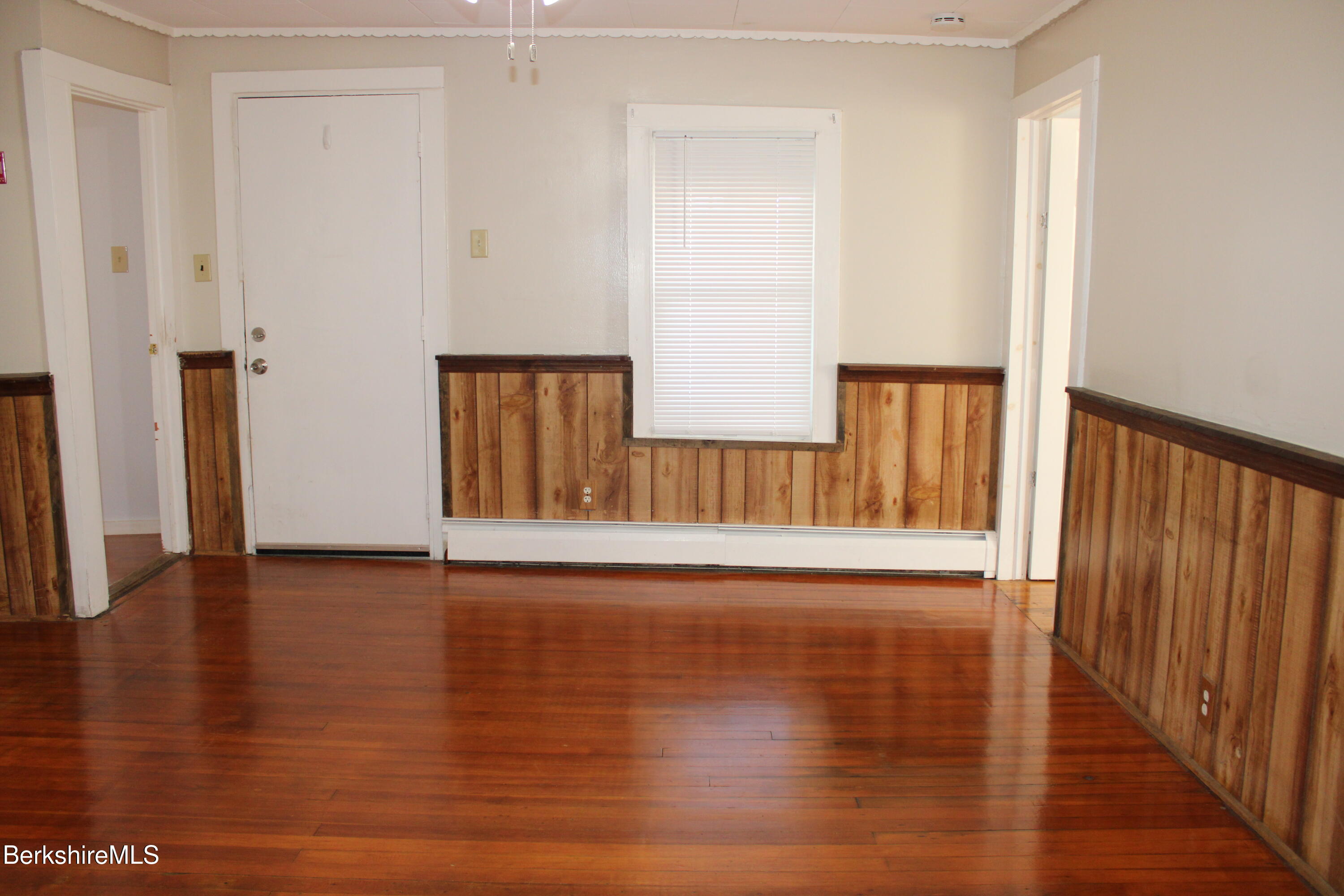 3-5 Pleasant Street Pittsfield, MA 01201 - Photo 4 of 40 a view of a hallway with wooden floor