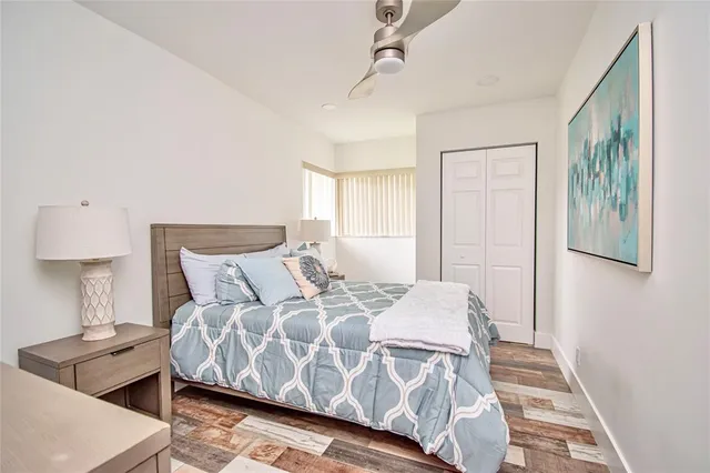 a bedroom with a bed and a lamp