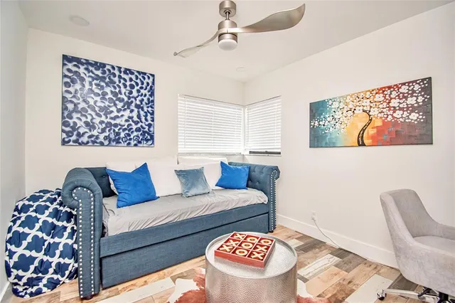 a living room with furniture and a rug