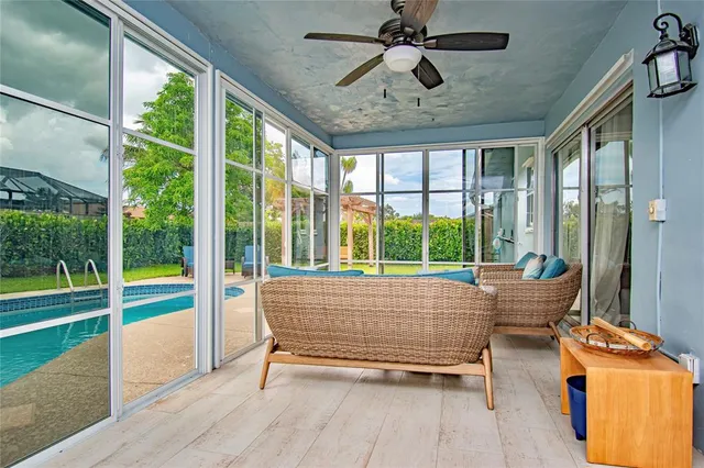 a living room with couch and windows