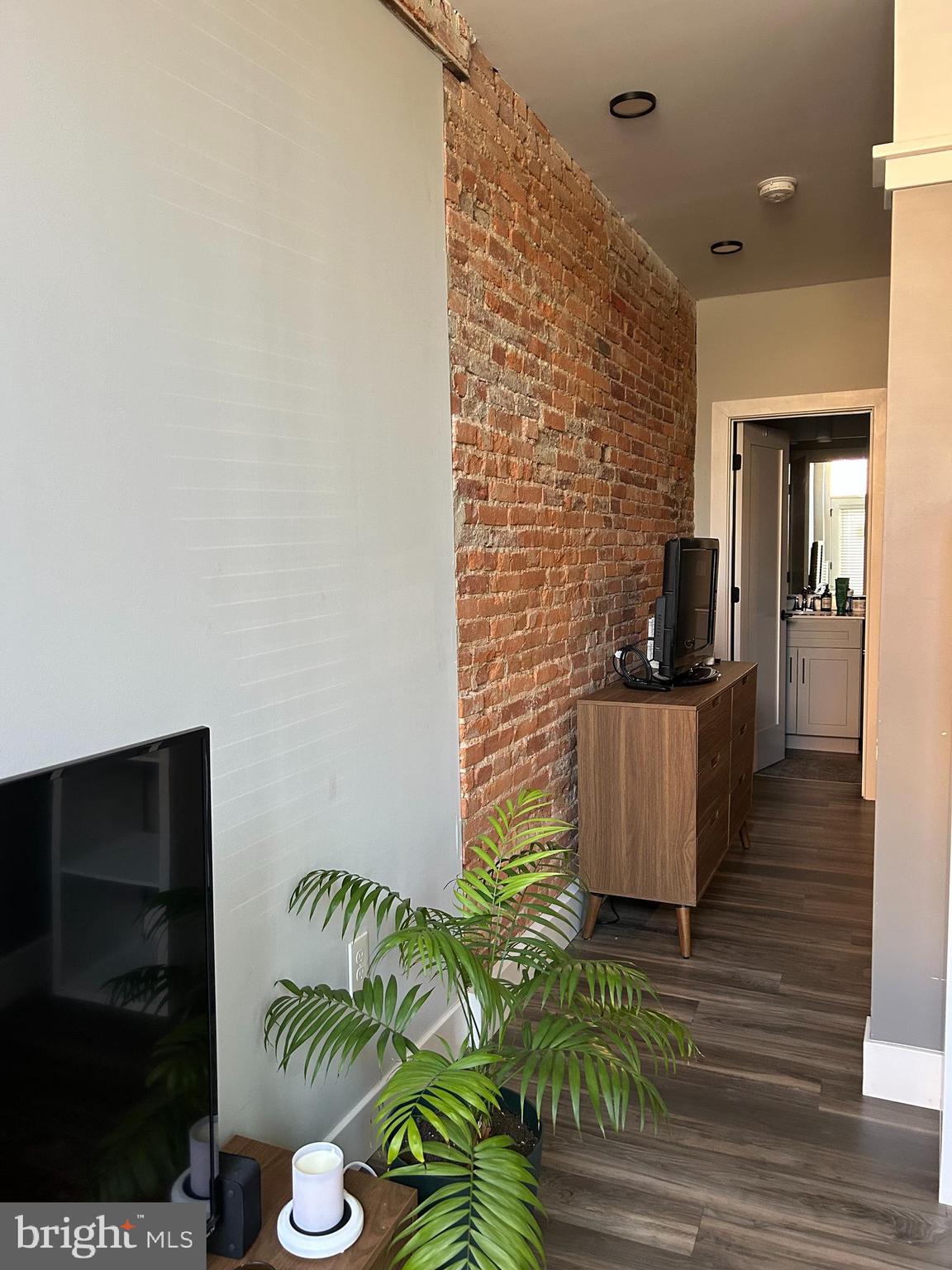 719 North Duke Street, Unit 8 Lancaster, PA 17602 - Photo 6 of 7 a view of a hallway with wooden floor and plants