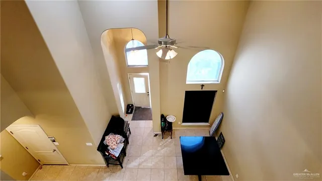 a living room with furniture and a mirror