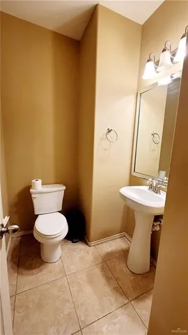 a bathroom with a toilet and a sink