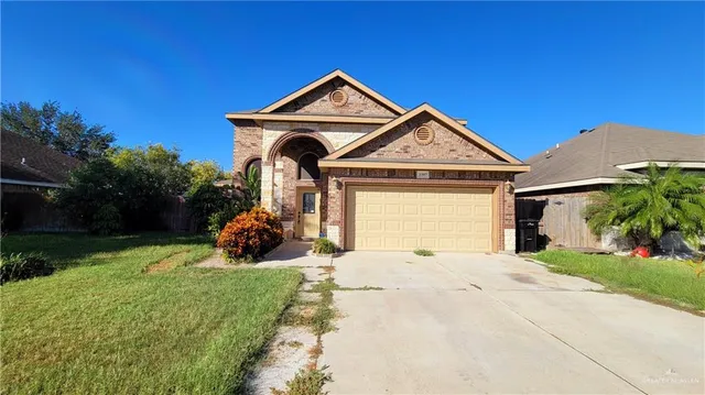a front view of a house with a yard outdoor seating and garden