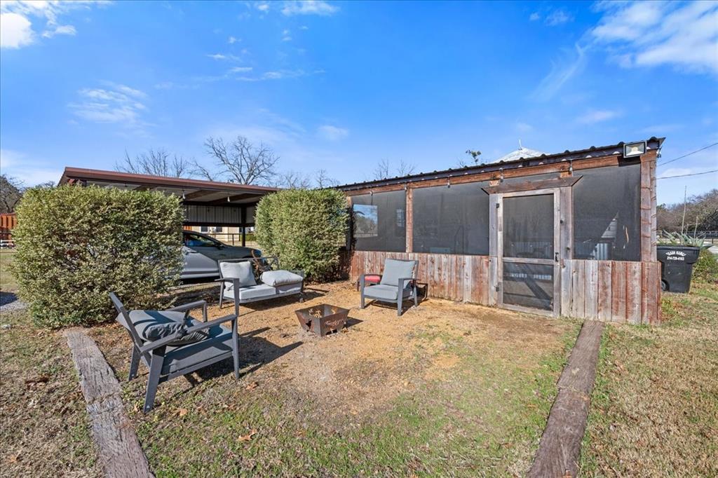 550 Fm 1389 Street South Combine, TX 75159 - Photo 23 of 36 a view of a chairs and table in a backyard