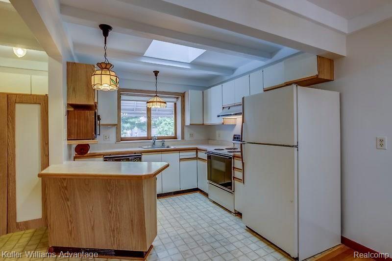 11323 Inkster Road Livonia, MI 48150 - Photo 8 of 24 Bright kitchen with 2nd skylight and huge closet on left - could be 1st floor laundry room