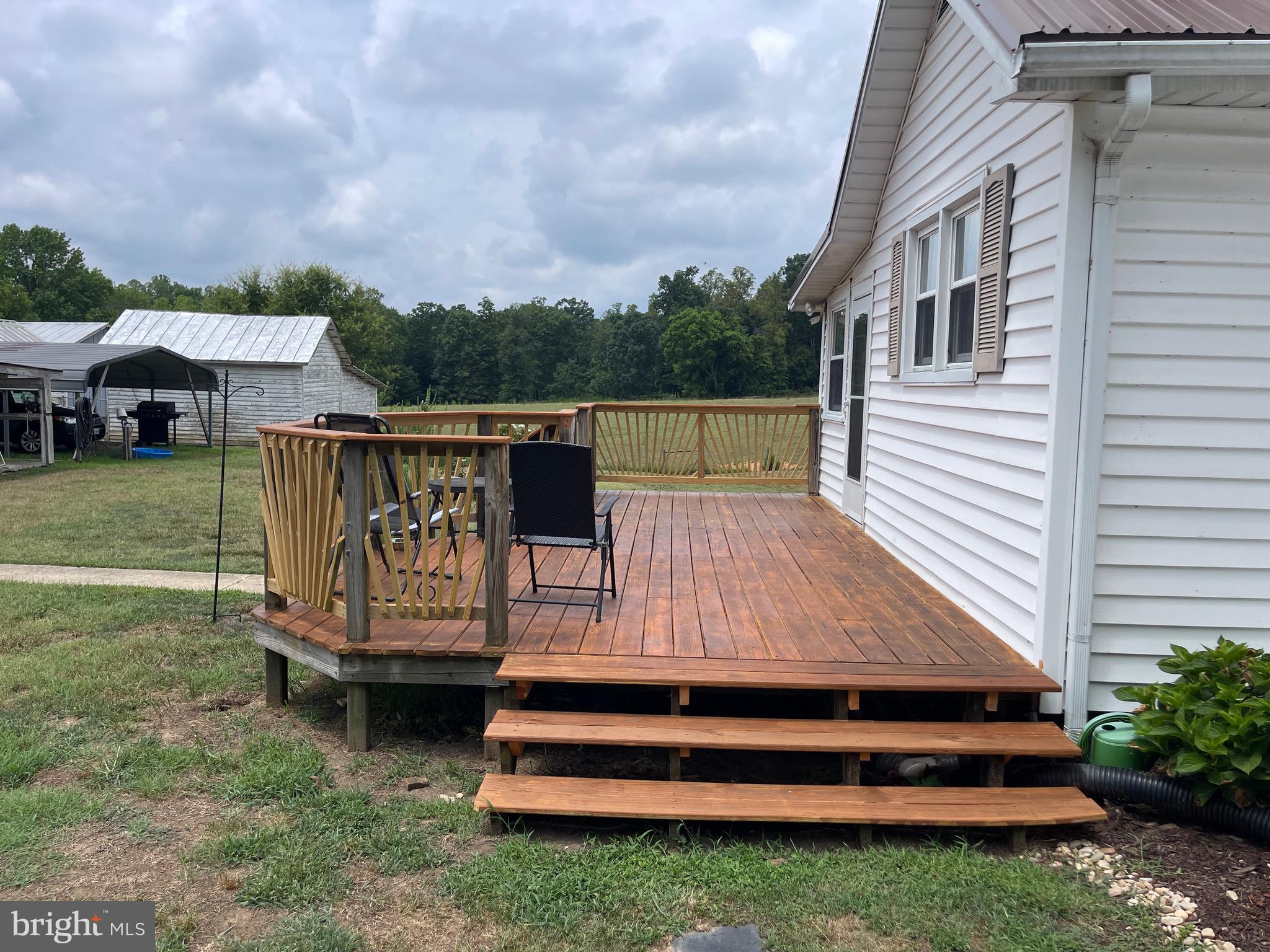 2092 Rocksprings Road Ringgold, VA 24586 - Photo 13 of 86 a view of a wooden deck with a big yard