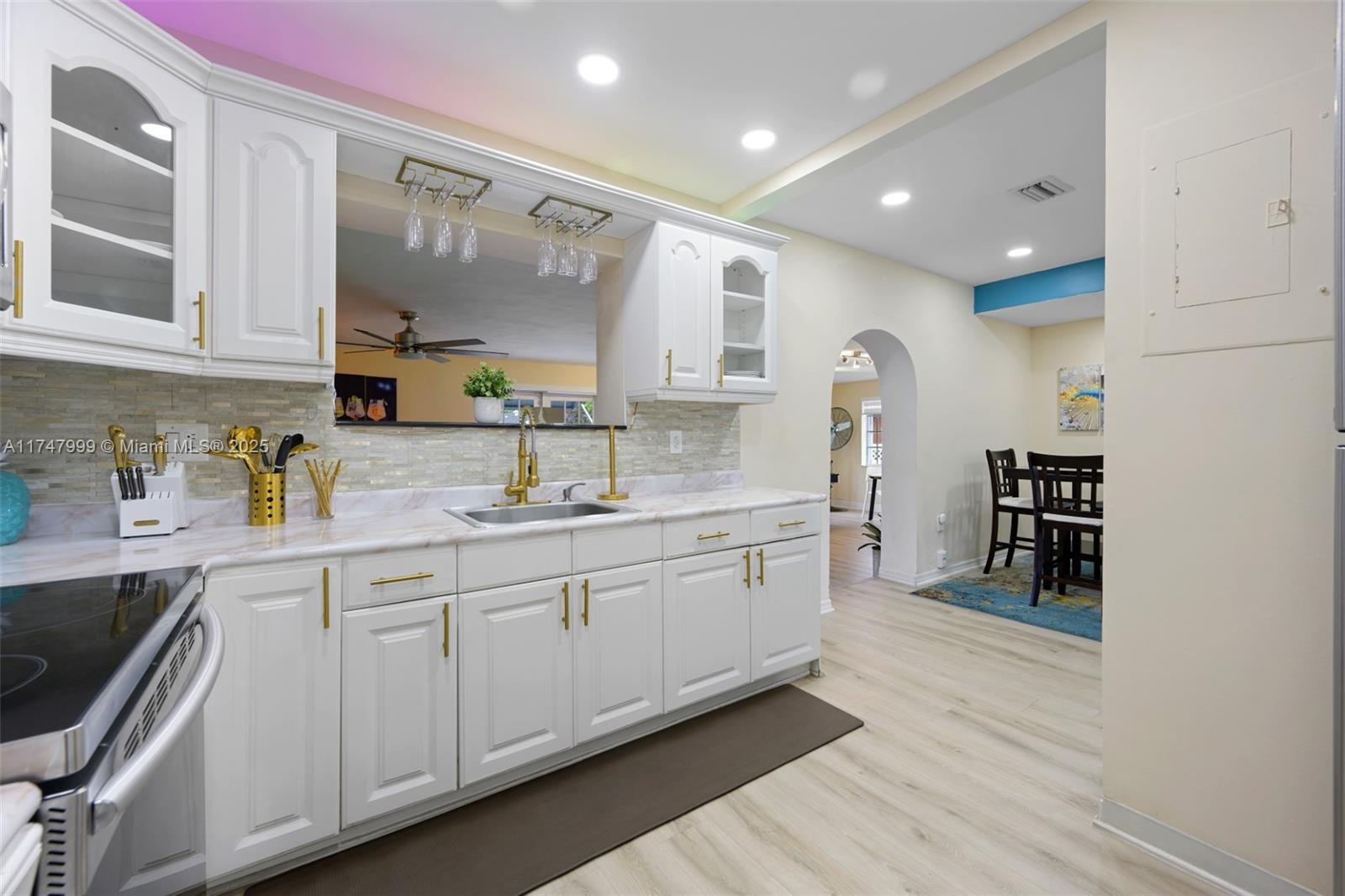951 Northwest 148th Street Miami, FL 33168 - Photo 12 of 36 a kitchen with sink cabinets and counter space