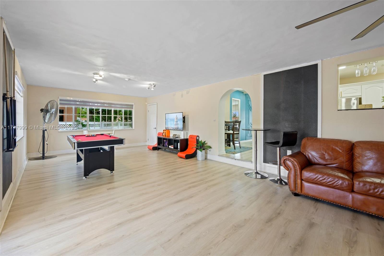 951 Northwest 148th Street Miami, FL 33168 - Photo 14 of 36 a living room with furniture and a wooden floor