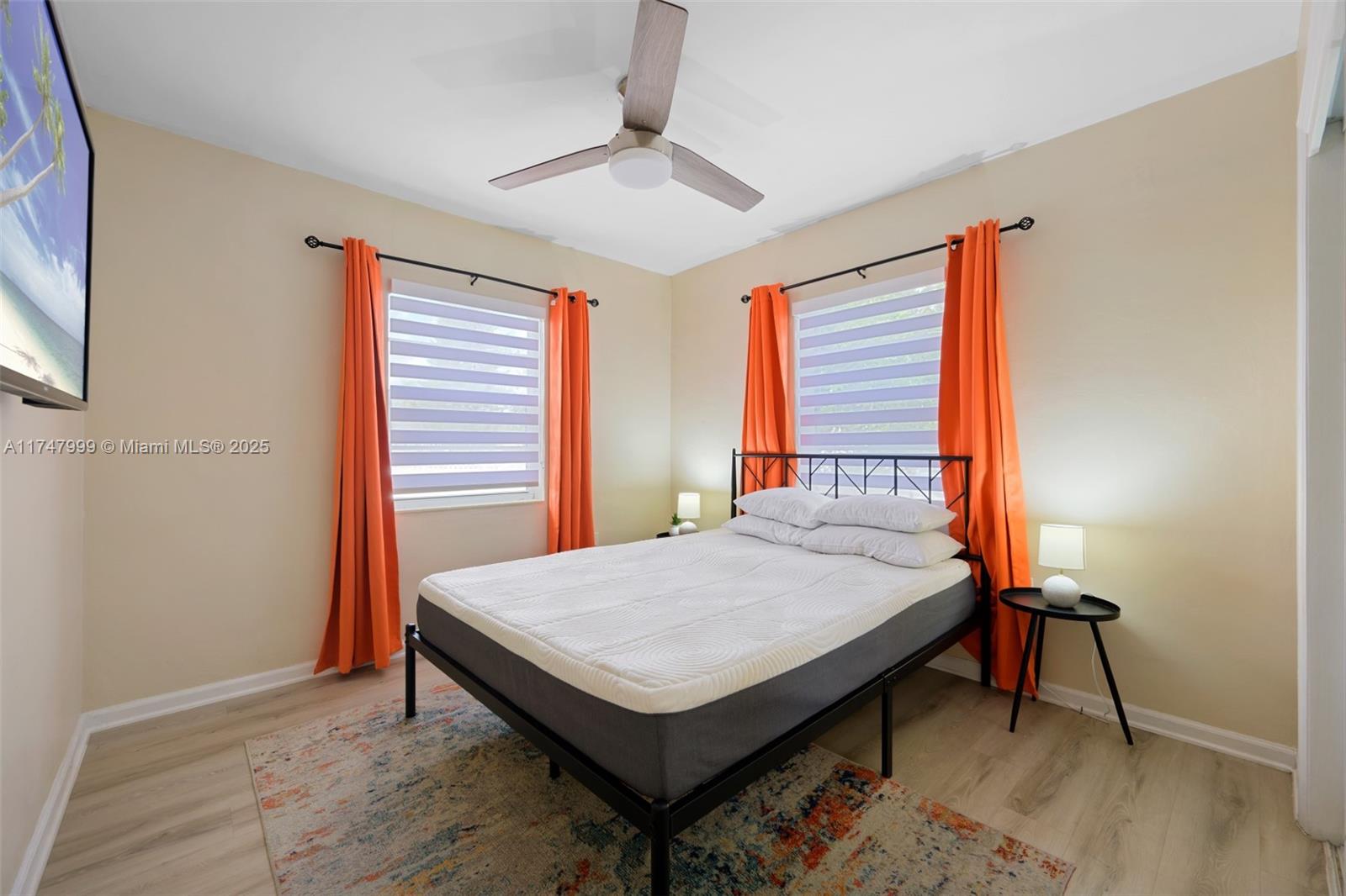 951 Northwest 148th Street Miami, FL 33168 - Photo 20 of 36 a bedroom with a bed and a table