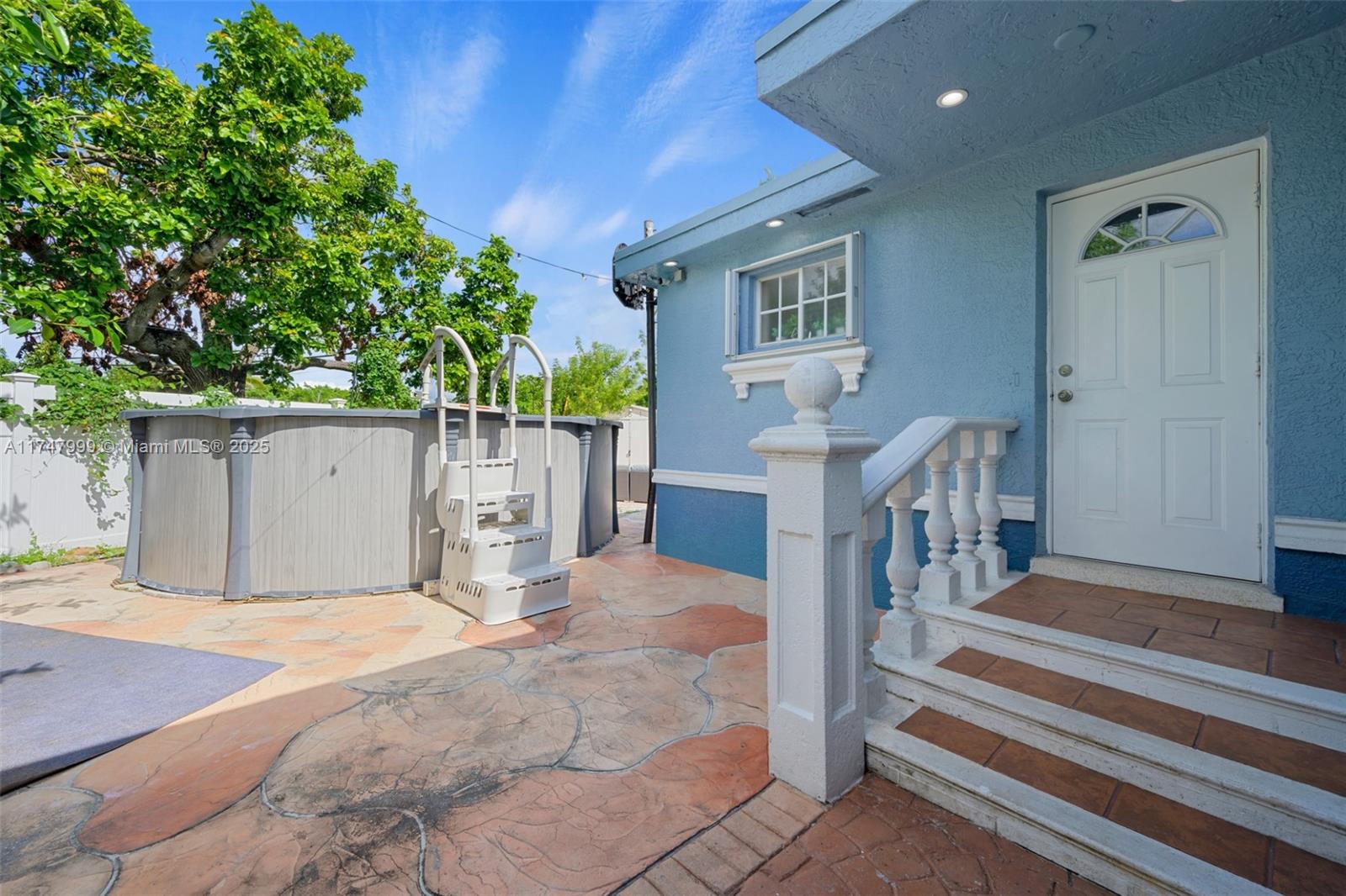951 Northwest 148th Street Miami, FL 33168 - Photo 29 of 36 a view of a house with a backyard and a garage