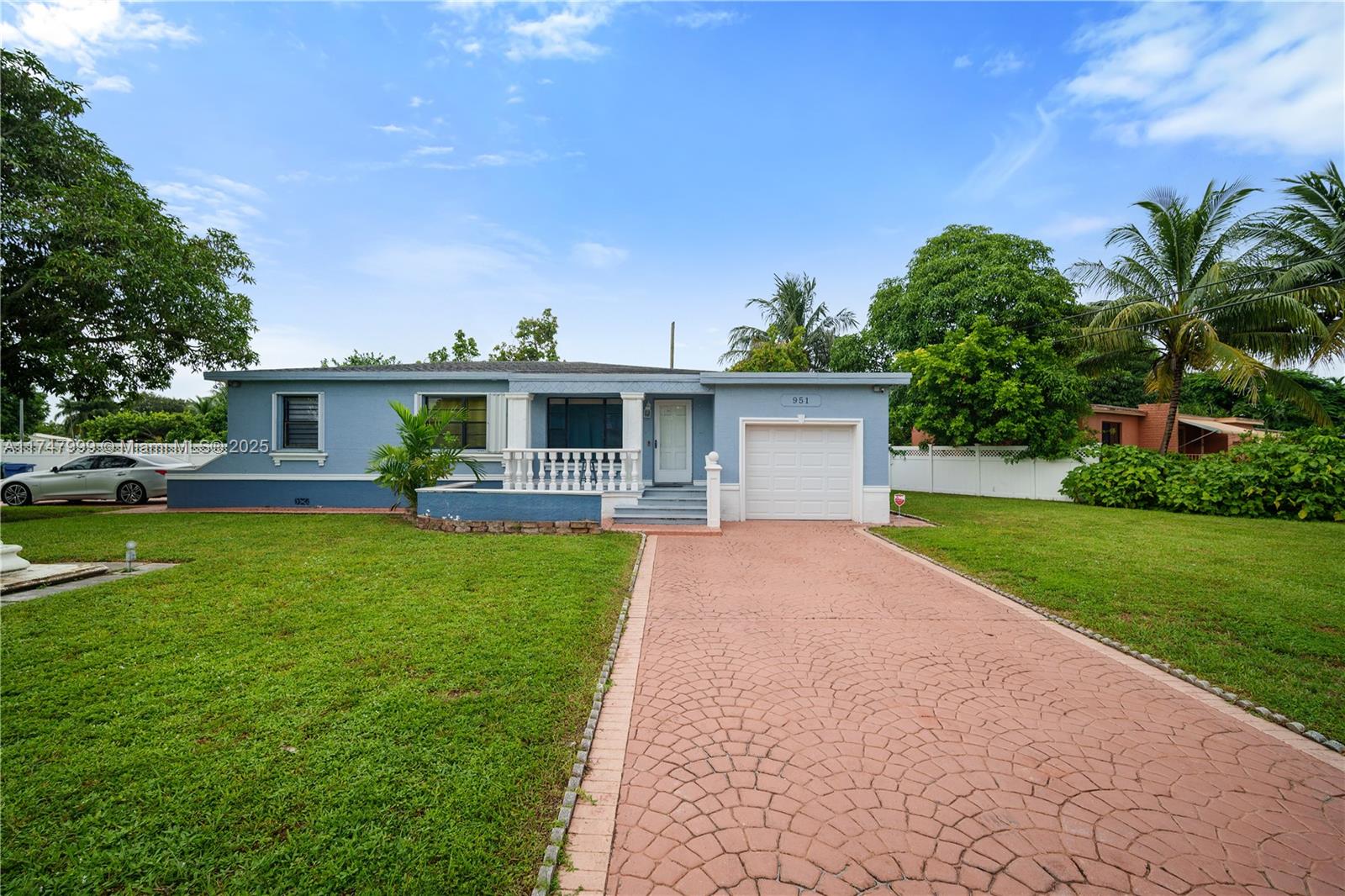 951 Northwest 148th Street Miami, FL 33168 - Photo 5 of 36 a front view of house with yard and green space