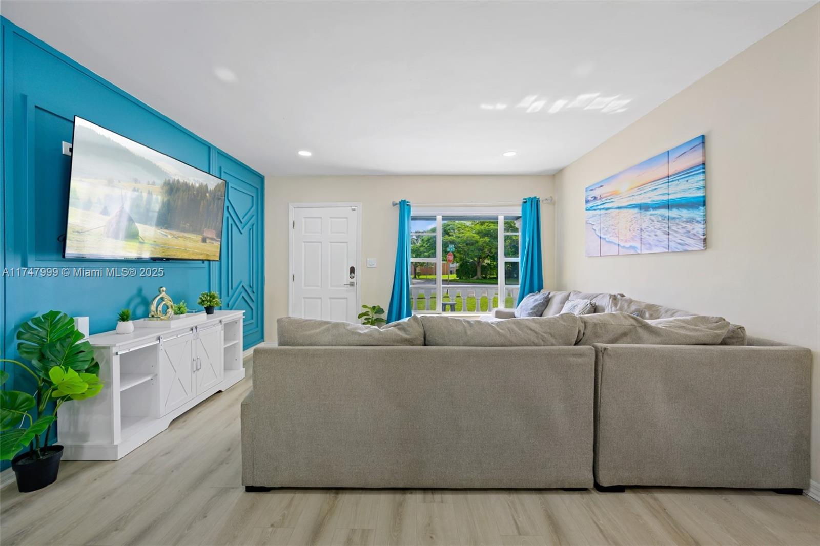 951 Northwest 148th Street Miami, FL 33168 - Photo 6 of 36 a living room with furniture and a flat screen tv