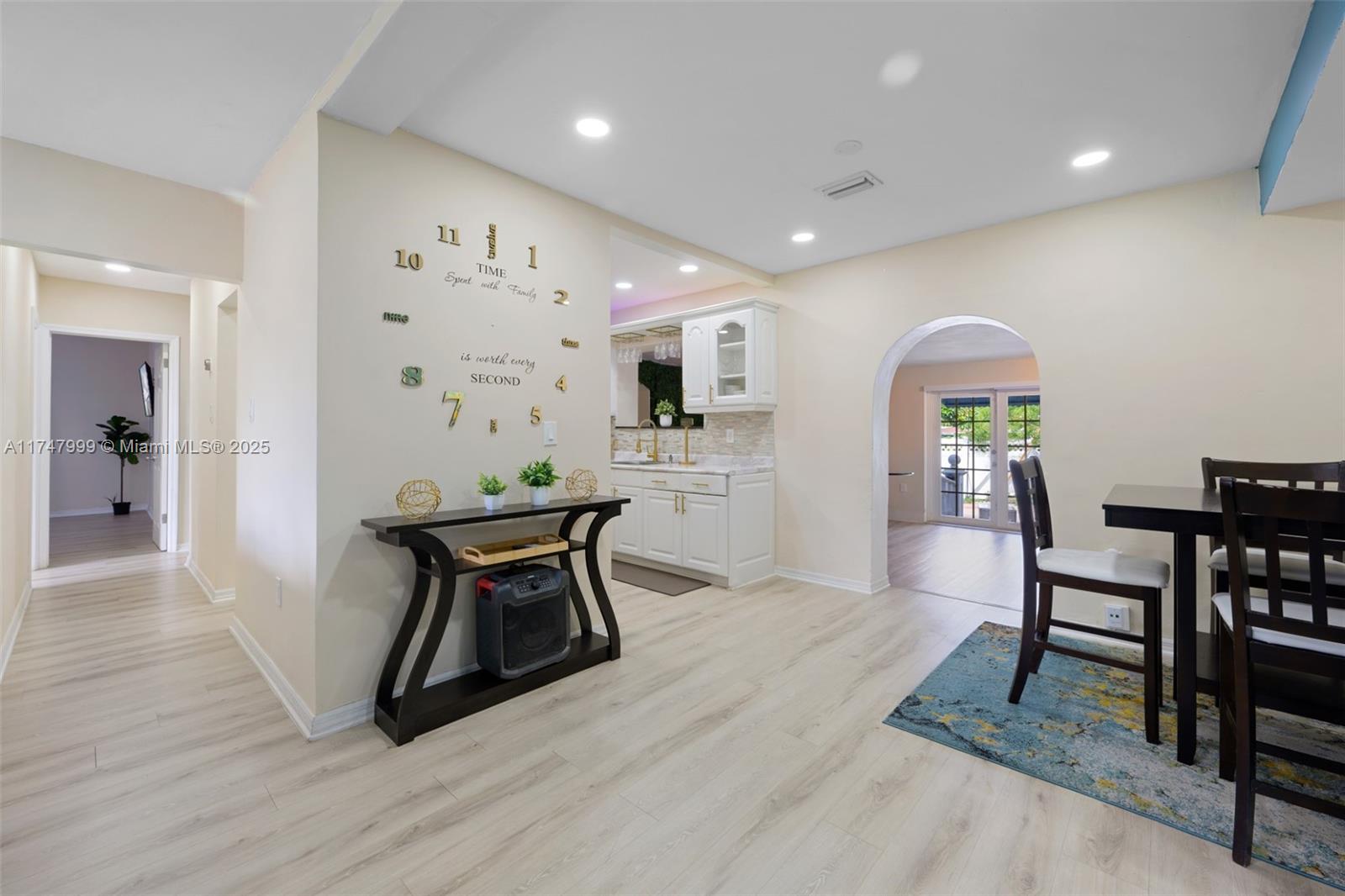 951 Northwest 148th Street Miami, FL 33168 - Photo 8 of 36 a workspace with furniture window and wooden floor