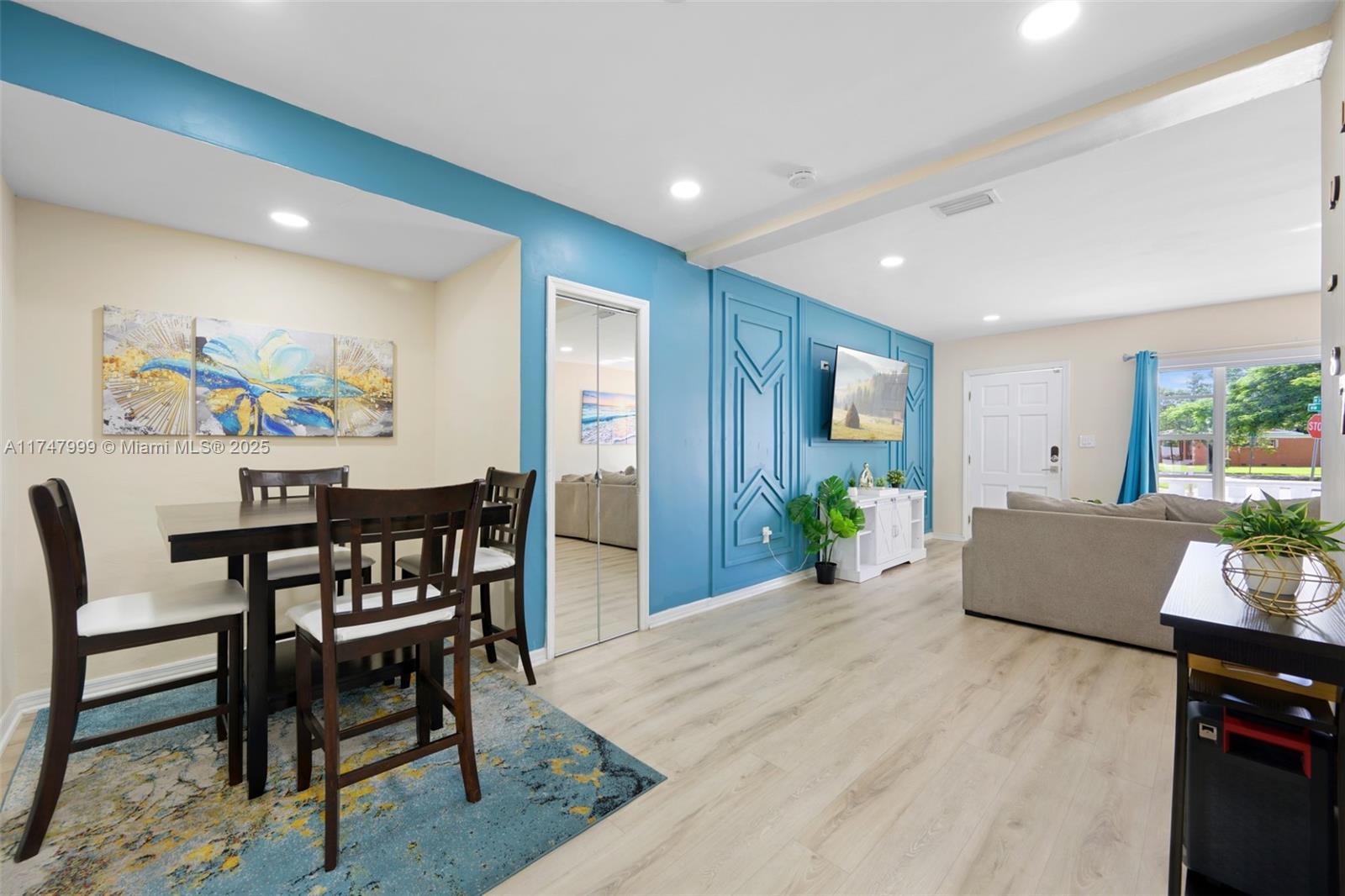 951 Northwest 148th Street Miami, FL 33168 - Photo 9 of 36 a view of a dining room with furniture and wooden floor