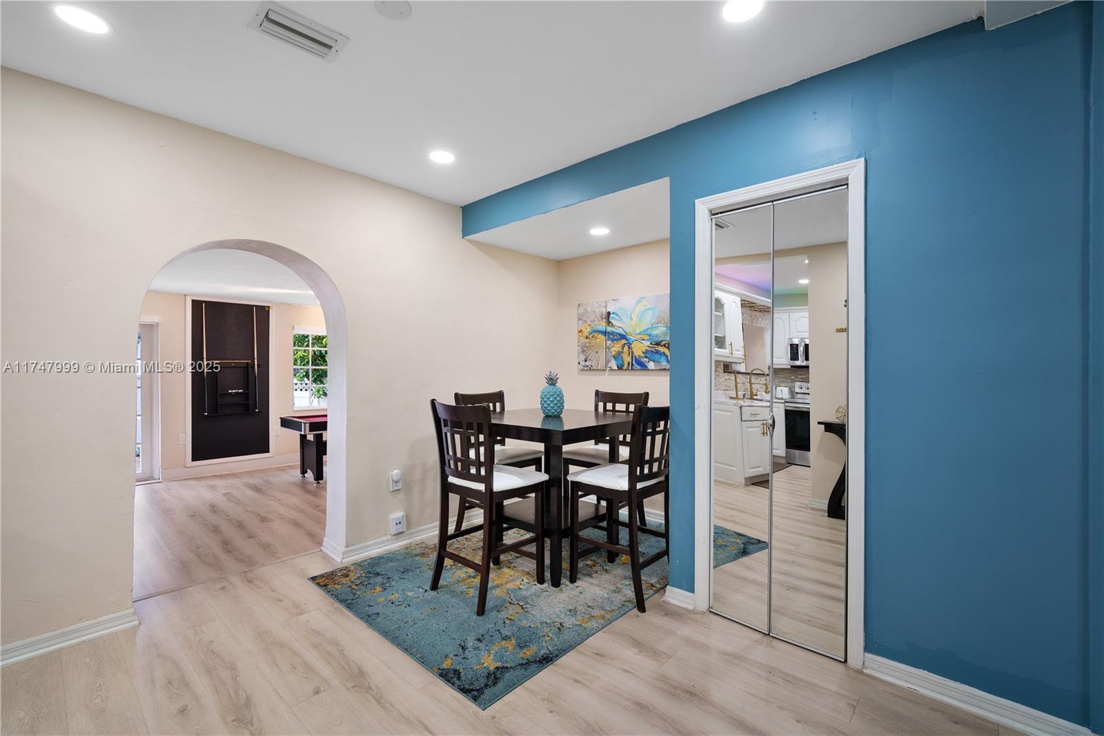 951 Northwest 148th Street Miami, FL 33168 - Photo 10 of 36 a view of a dining room with furniture and wooden floor