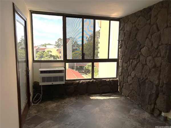a view of an empty room with a window