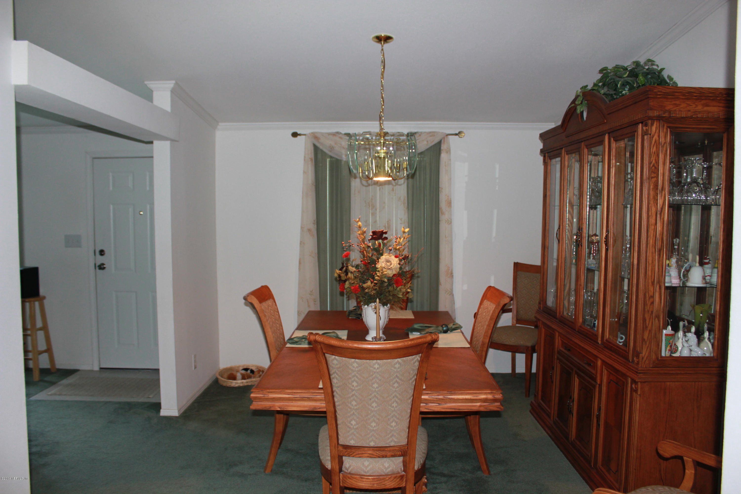 4132 Pinto Road, Unit E Middleburg, FL 32068 - Photo 8 of 27 a view of a dining room with furniture and window