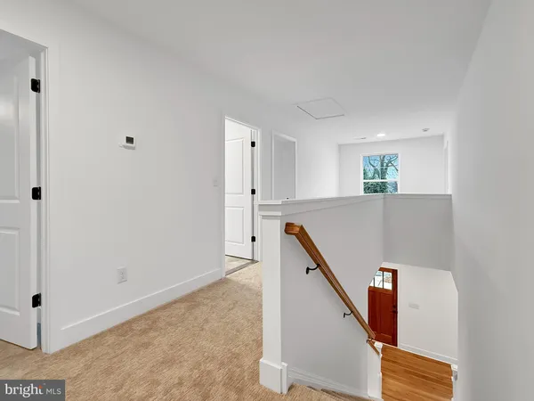a view of a hallway with staircase