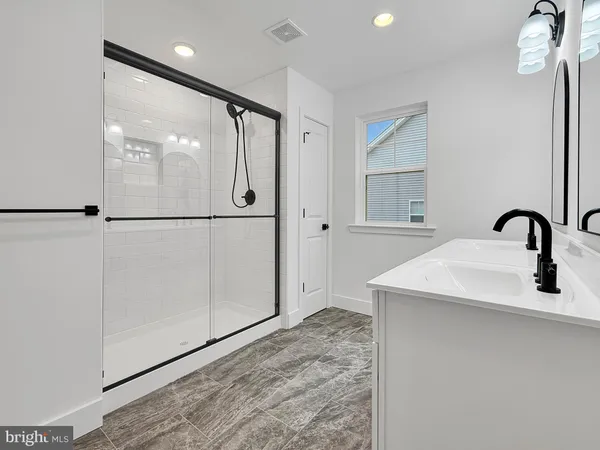 a bathroom with a sink and mirror