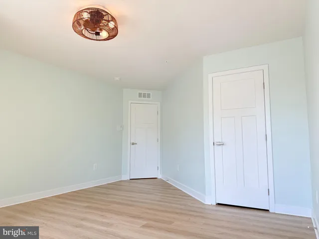 an empty room with a wooden floor