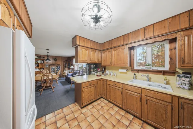 a kitchen with a sink stainless steel appliances and cabinets