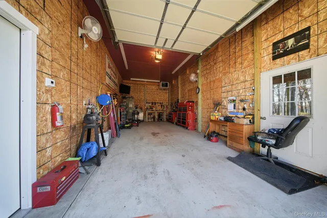 a view of a garage with rack and bicycle