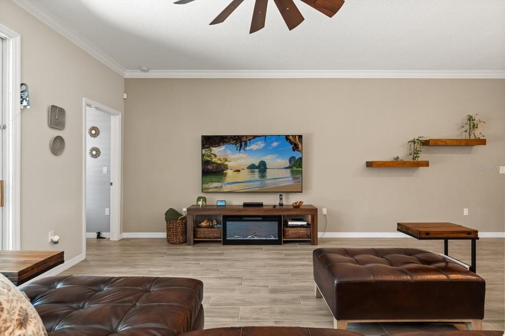 100 Silver Maple Road Groveland, FL 34736 - Photo 11 of 54 a living room with furniture and a flat screen tv